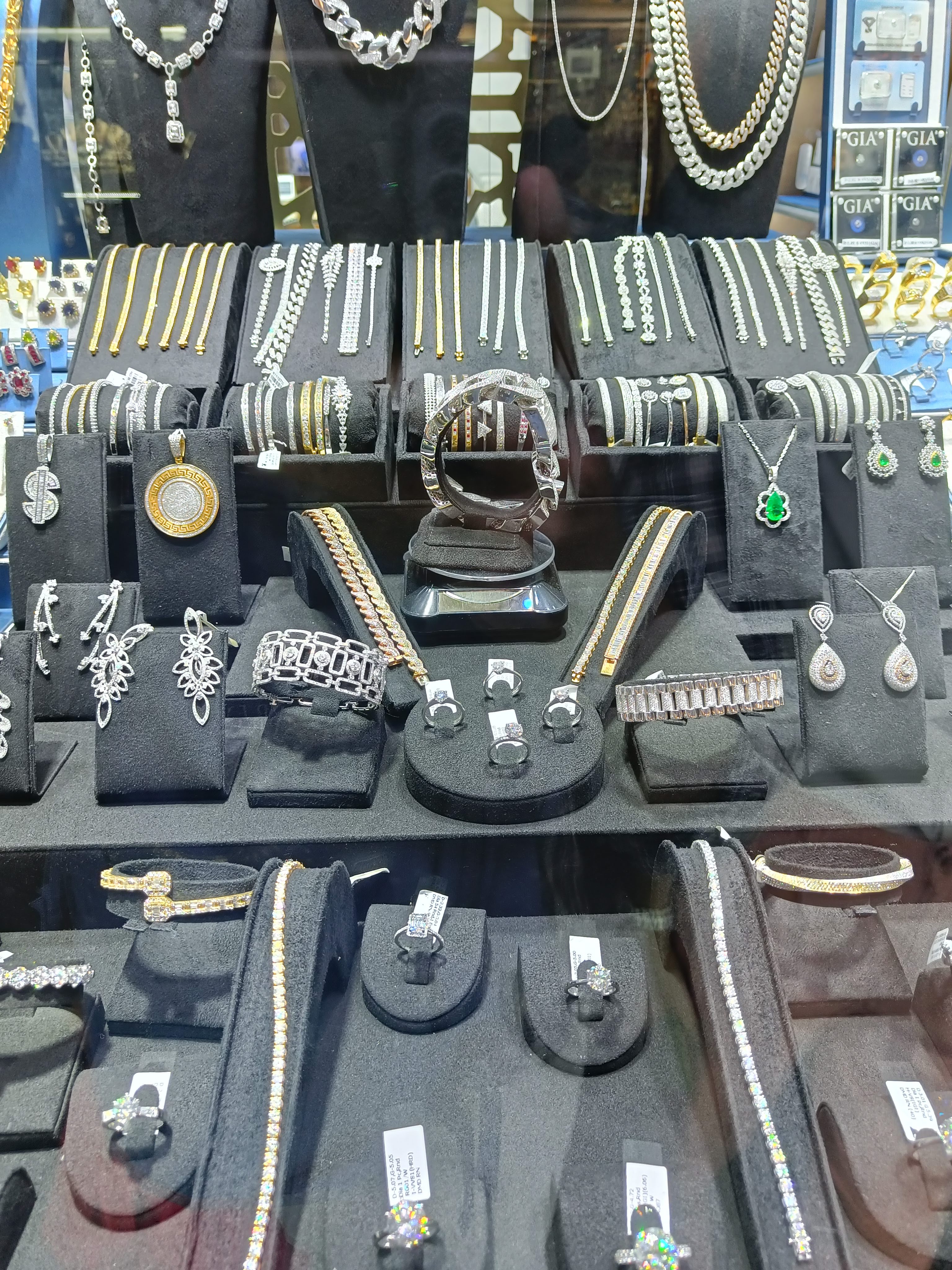 Gold Souk shop window with elaborate gold necklaces and jewelry - famous Dubai shopping destination for precious metals